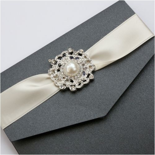 black ivory vintage chandelier pocketfold wedding invitation with large diamante pearl brooch