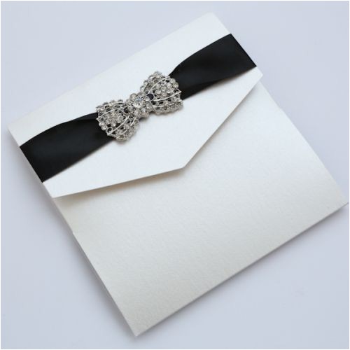 ivory vintage chandelier pocketfold wedding invitation with art deco bow black ribbon
