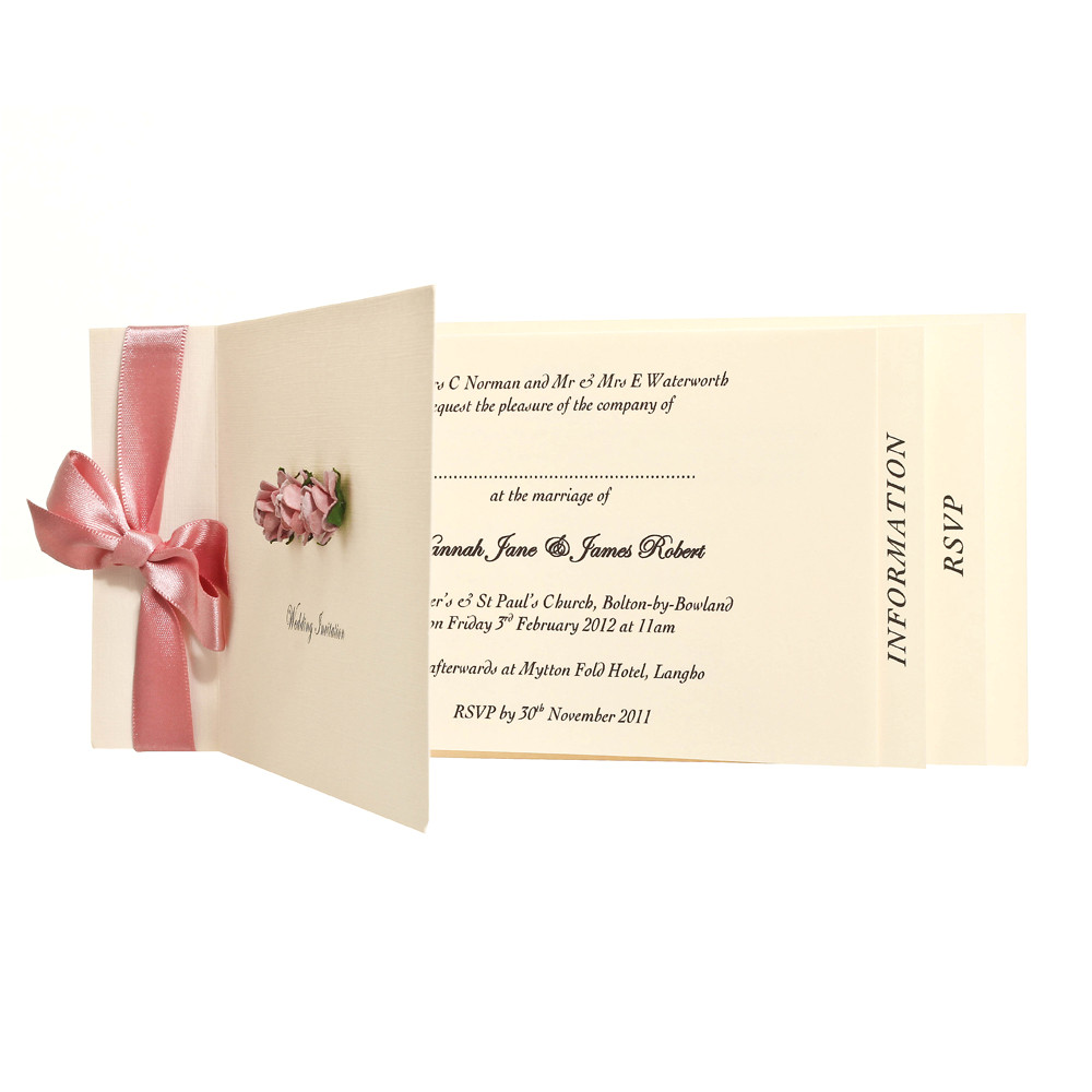 vintage cheque book style invitation with ribbon and coloured paper roses